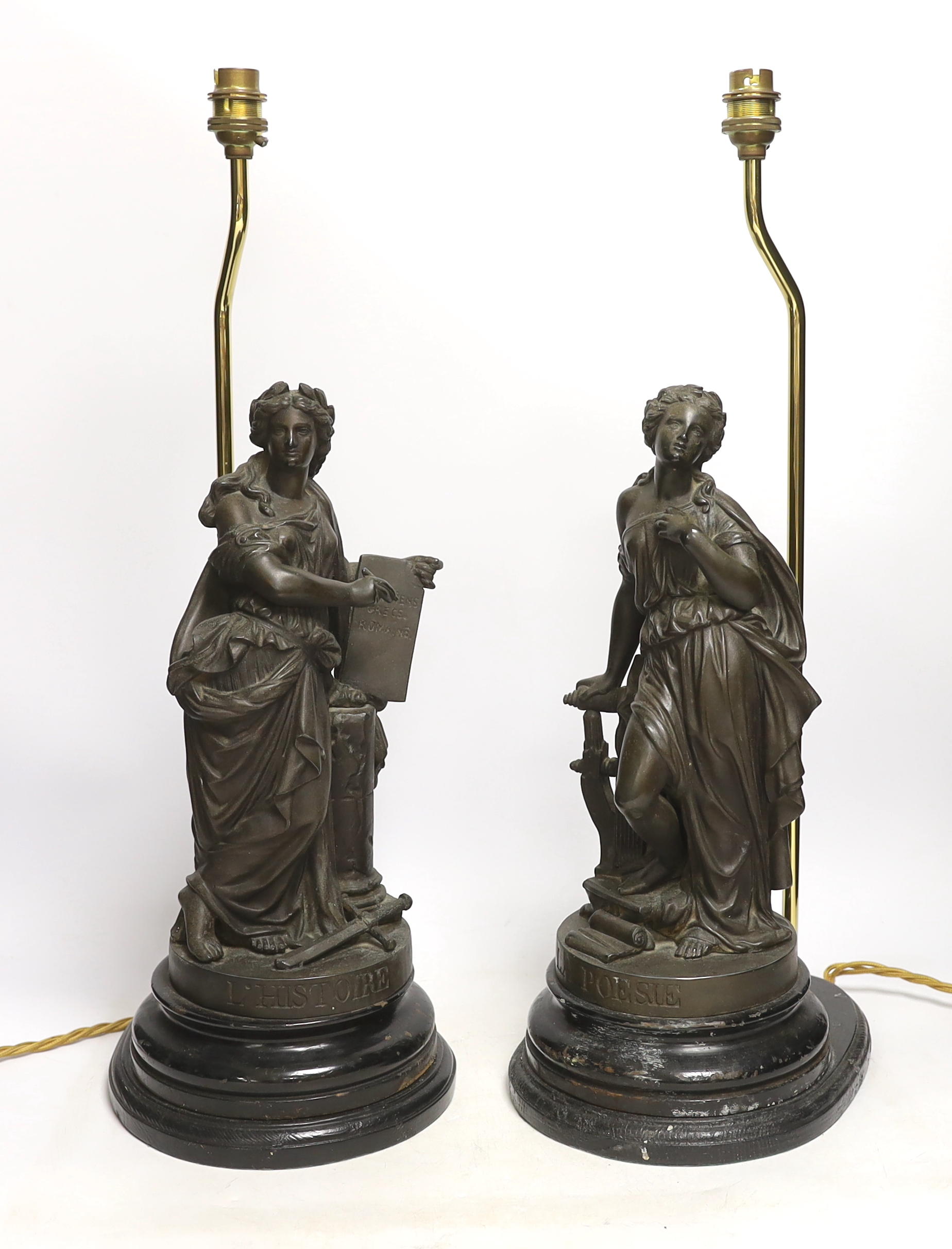 A pair of spelter figural table lamps emblematic of poetry and history, overall 56cm high